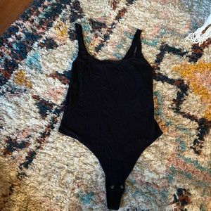 Gently used black garage body suit